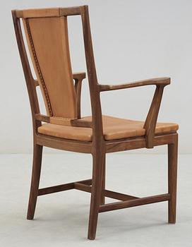 A Carl-Axel Acking walnut armchair, upholstered in light brown leather, Nordiska Kompaniet, Sweden, ca 1947.