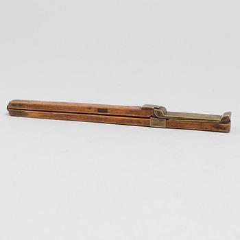 A 19th century wooden measuring stick.