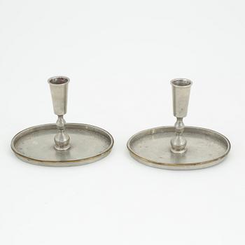 Nils Fougstedt, probably, a pair of pewter and brass candlesticks, model '93', for Firma Svenskt Tenn, Stockholm 1926.