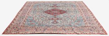 A semi-antique Qum carpet. Central Persia, c. 345 x 258 cm.