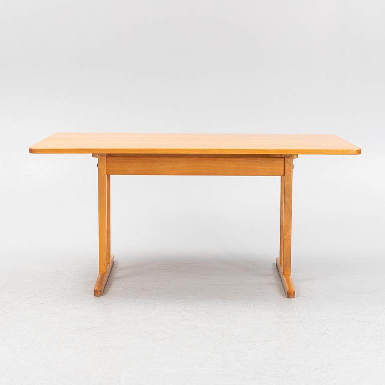 A beech dining table, second half of the 20th Century.