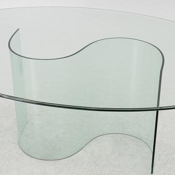 A dining table, glass, contemporary.