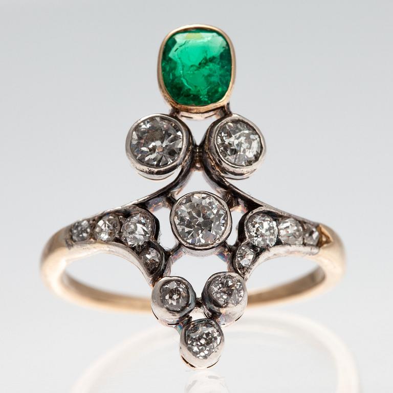 A RING, old cut diamonds c. 0.80 ct, emerald 4,5 x 5,5 mm. Size 17+. Weight 3,8 g.