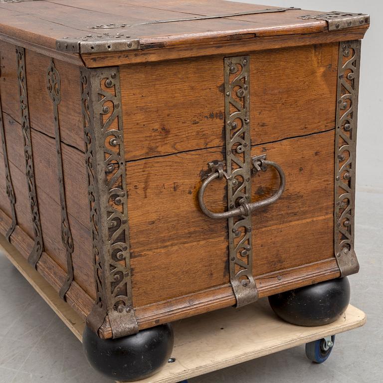 A 18th century baroque oak chest with iron mountings.