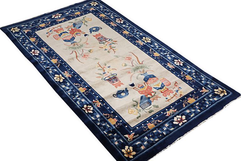 A rug, China, antique finish, ca 206 x 117 cm.