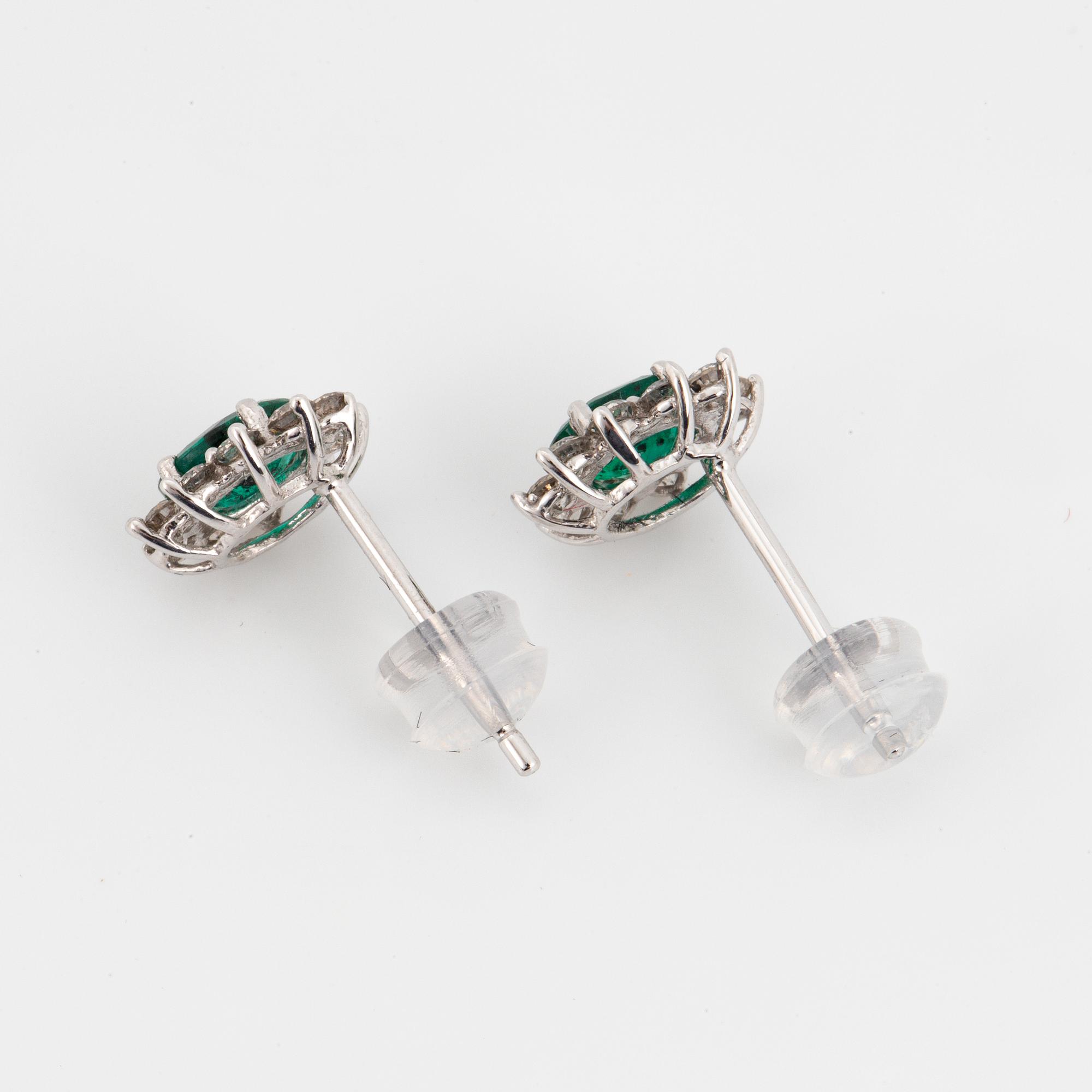 Emerald and brilliant-cut diamond cluster earrings.