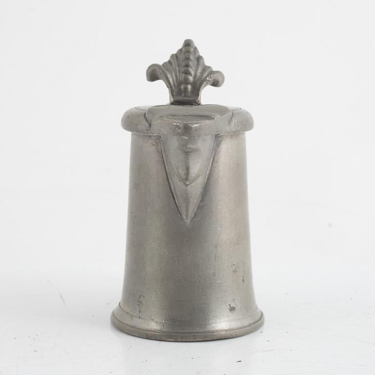 A pewter measuring cup by an unidentified master, dated 1766.