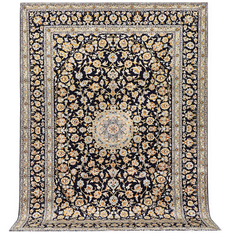 A Kashan carpet, c. 365 x 259 cm.