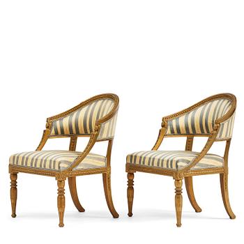 75. A pair of late Gustavian open armchairs attributed to E. Ståhl (master in Stockholm 1794-1820).