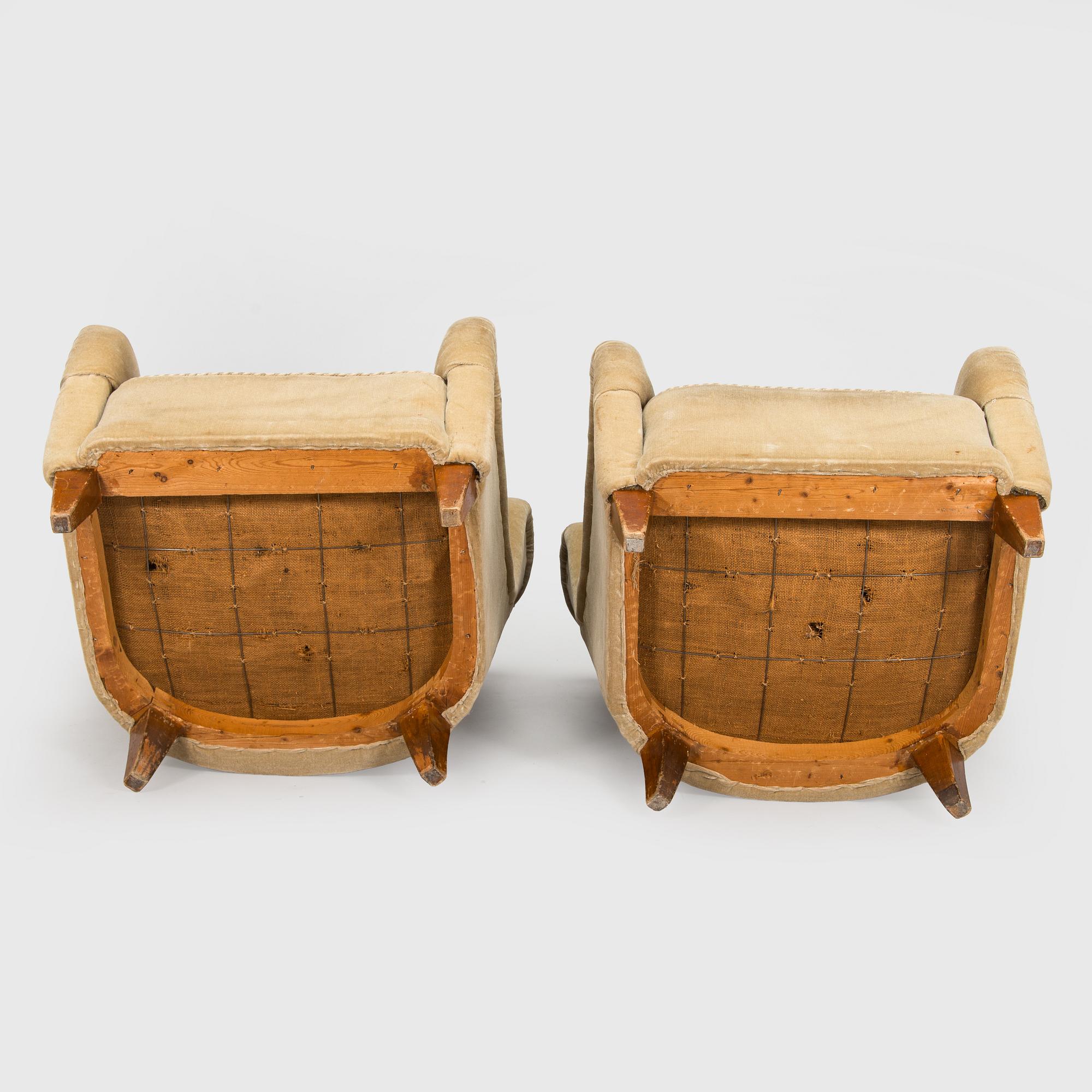 A pair of mid-20th century armchairs.