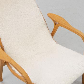Yngve Ekström, a 'Lamino' armchair and a foot stool, Swedese.
