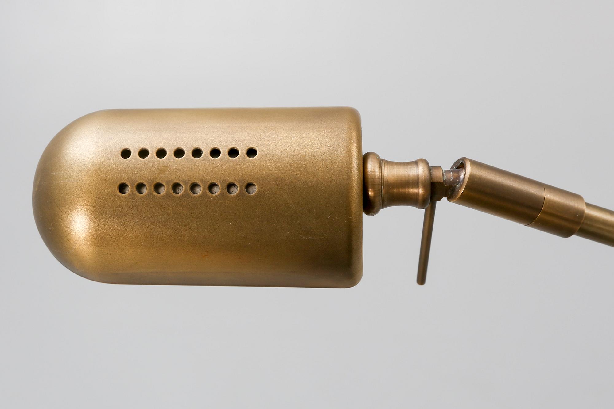 A pair of brass floor lamps 21 st century.