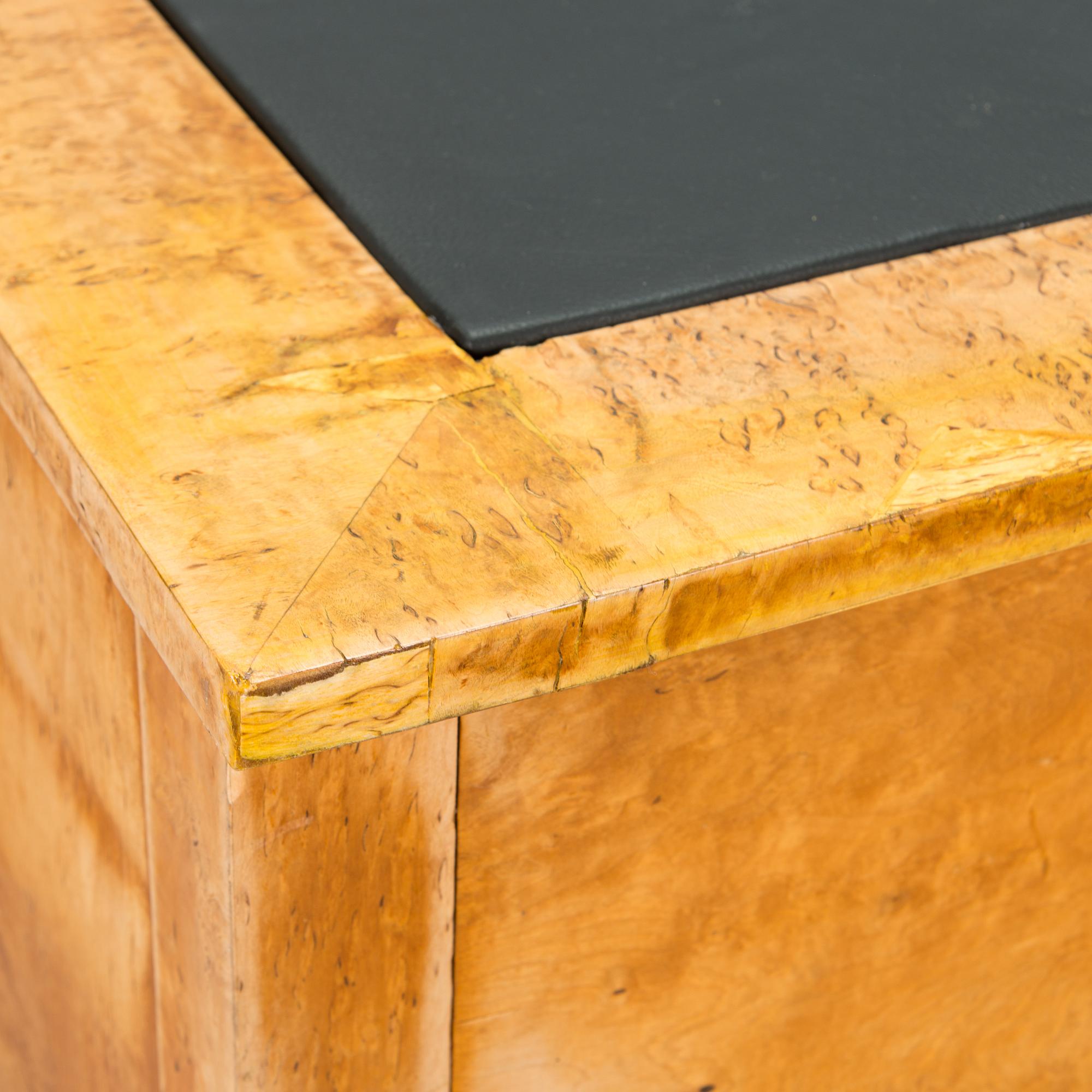 A late 19th-century curly birch veneered writing desk.