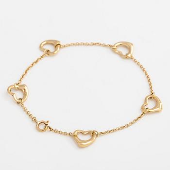 Tiffany & Co, Elsa Peretti, an 18K gold 'Open Heart' bracelet.