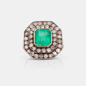 744. A circa 2.75 ct emerald and old-cut diamond ring. Total carat weight of diamonds circa 1.10 cts.