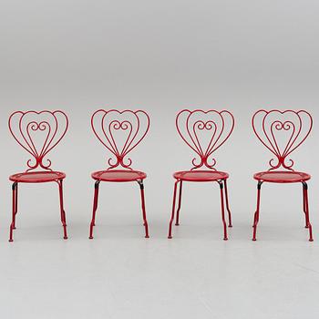 GARDEN FURNITURE, a table and four chairs, late 20th century.