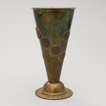 A late 19th Century brass cup.