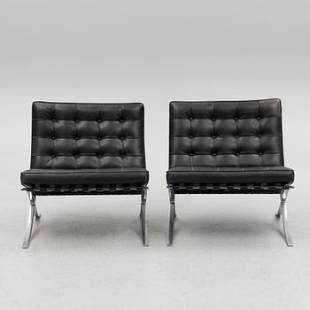 Ludwig Mies van der Rohe, a pair of "Barcelona" lounge chairs, Knoll.