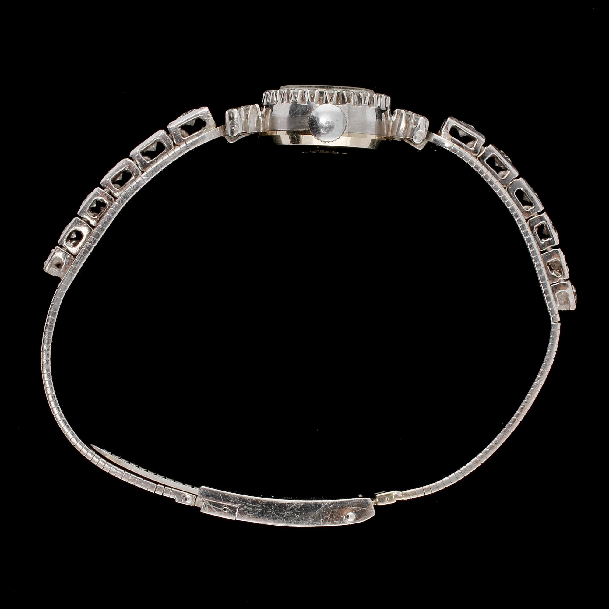 DAMARMBANDSUR, Reimar, 18k vitguld med 16 briljantslipade och 26 åttkantslipade diamanter, 1900-tal. Vikt 29 g.
