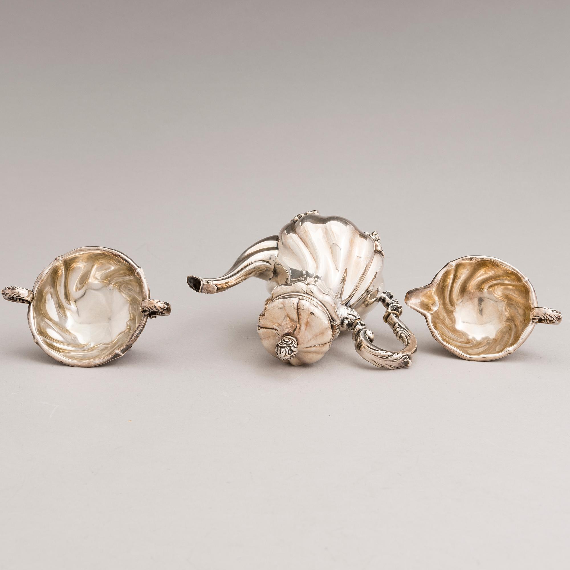 A silver sugar tong and a 3-piece silver coffee set, mark of Juho H. Pekuri, Oulu 1931 and Finnish import marks 1938.