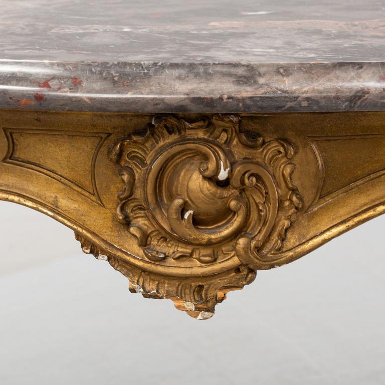 A rococo style table, around 1900.