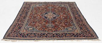 An Oriental rug, c. 195 x 132 cm.