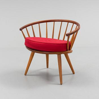 A teak 'Arka' armchair.