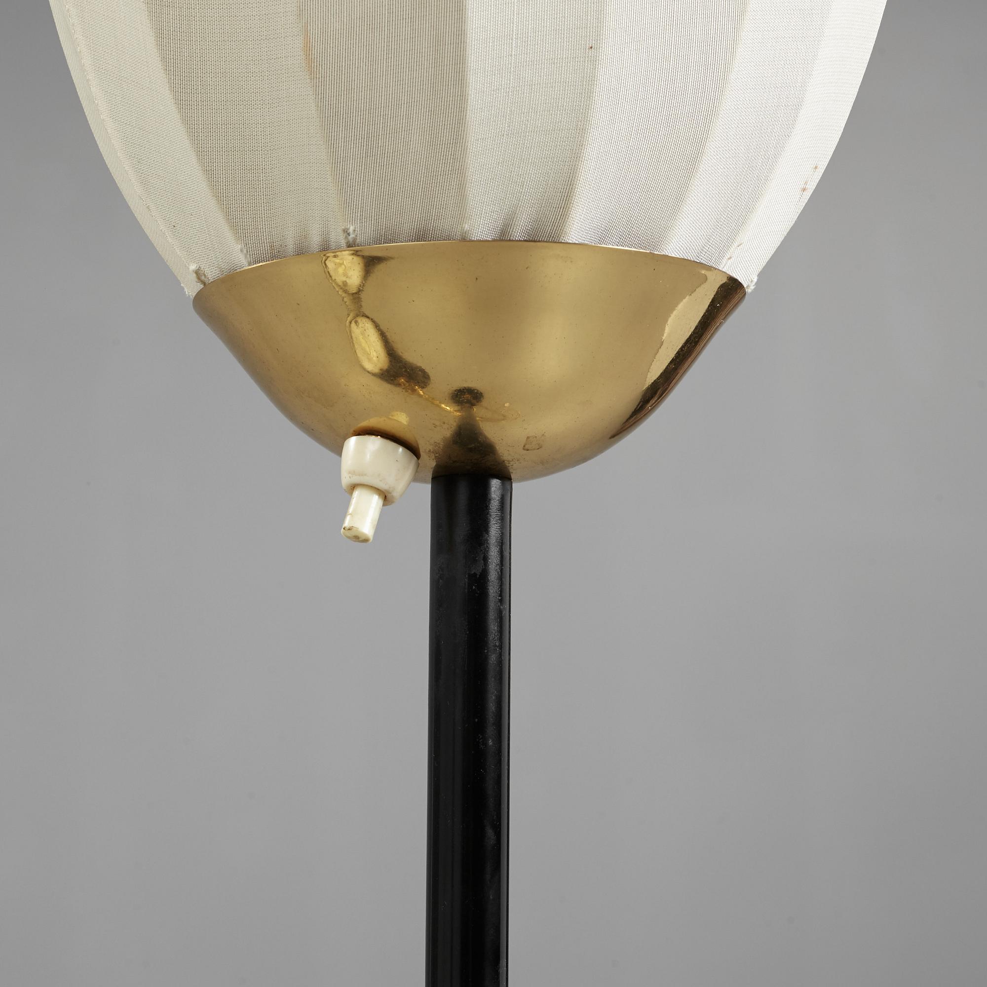 A Swedish Modern brass and black lacquered floor lamp, 1950's.