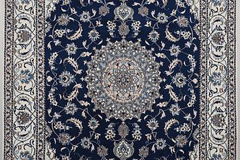 A carpet, Nain, part silk, ca 294 x 198 cm.