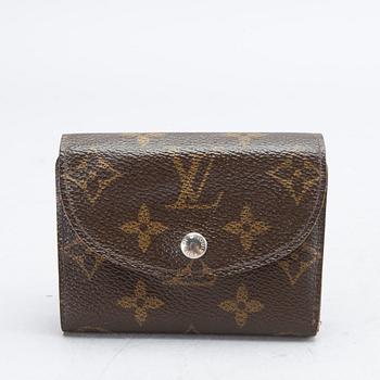 An 'Helene' wallet by Louis Vuitton.