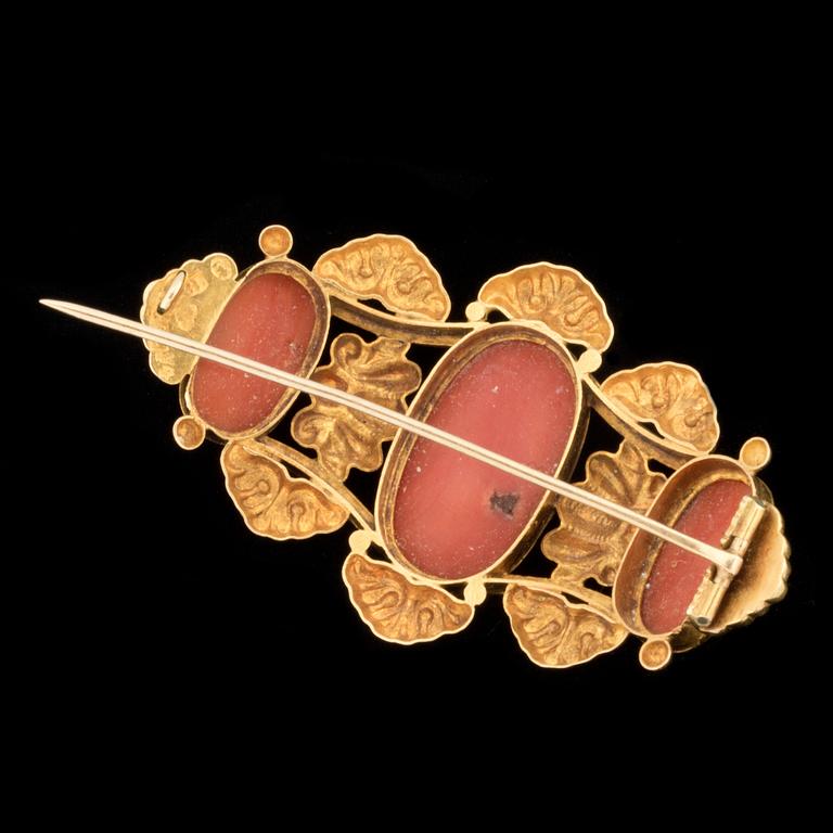 A 19th century carved coral cameo brooch.