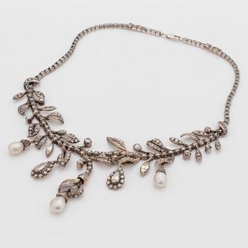An old-, rose- and pear shaped diamond and probably natural saltwater pearl necklace.