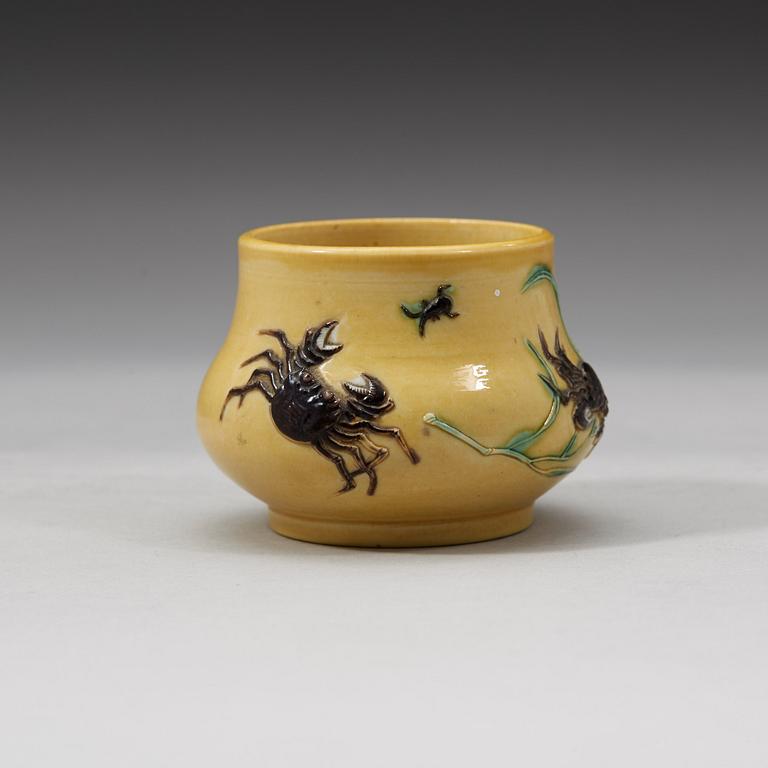 A yellow brush pot, Qing dynasty with Daoguang mark and period (1821-1850).