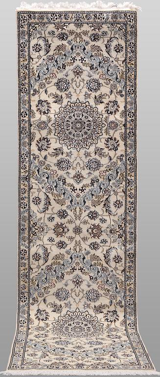 A Nain part silk runner carpet, 311 x 88 cm.
