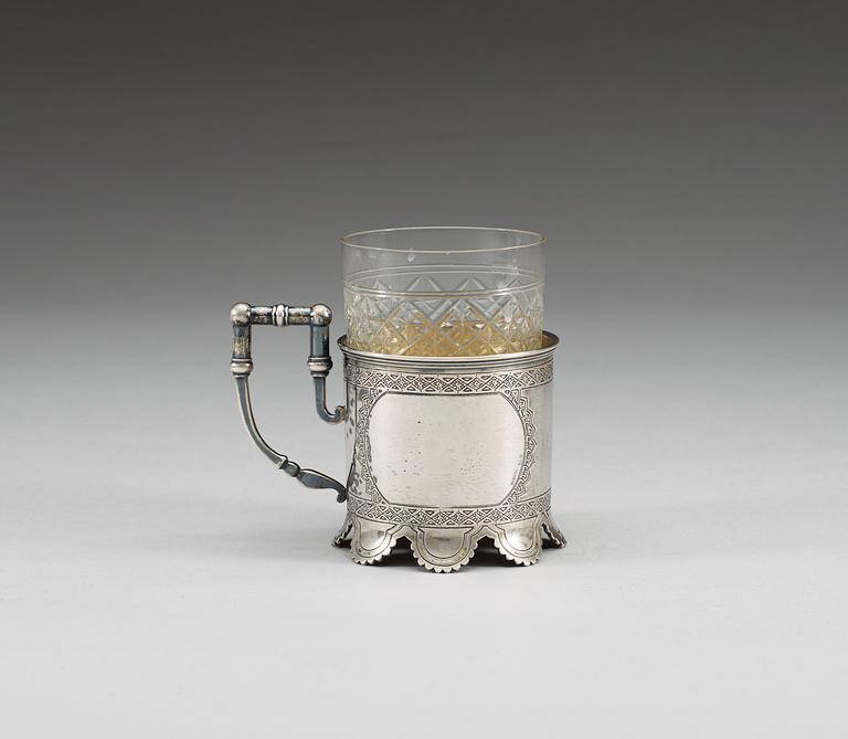 A RUSSIAN PARCEL-GILT TEA-GLASS HOLDER, un identified makers mark, Moscow 1884.