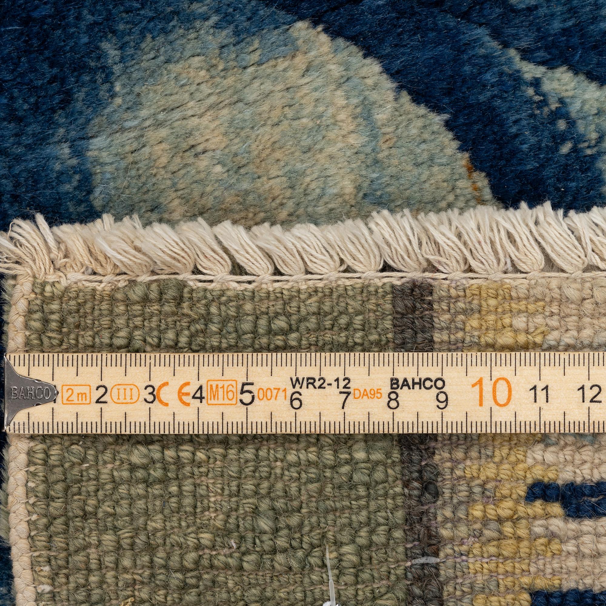 An antique Baotou rug, northern China, late Qing dynasty, around 1900. c. 252x151 cm.