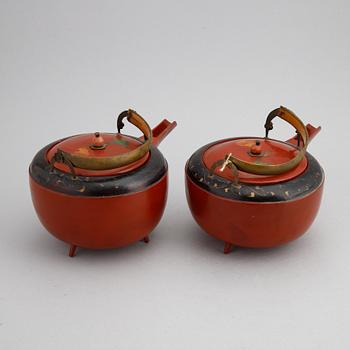 A pair of Japanese red lacquer pots, presumably Meiji (1868-1912).