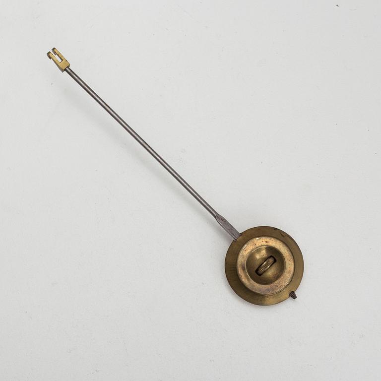 A brass wall clock marked A.W. Bruuns eftr, Lund from around year 1900.