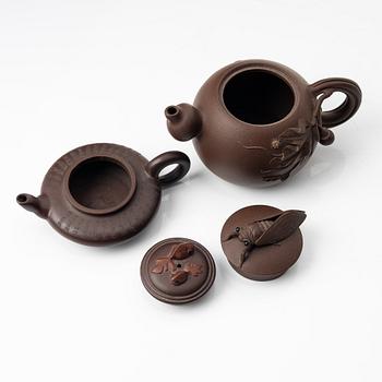 Two yixing teapots, China, 1980s and 2000.