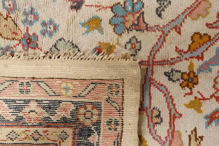 A rug from Smyrna, semi-antique, 417 x 300 cm.