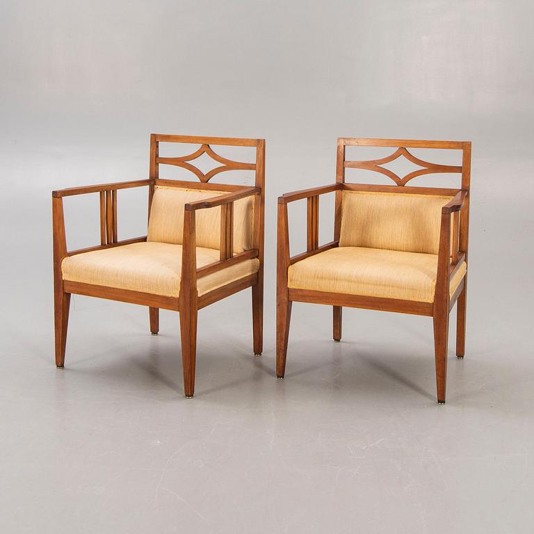 A pair of armchairs around 1900.