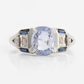Ring with light blue sapphire.