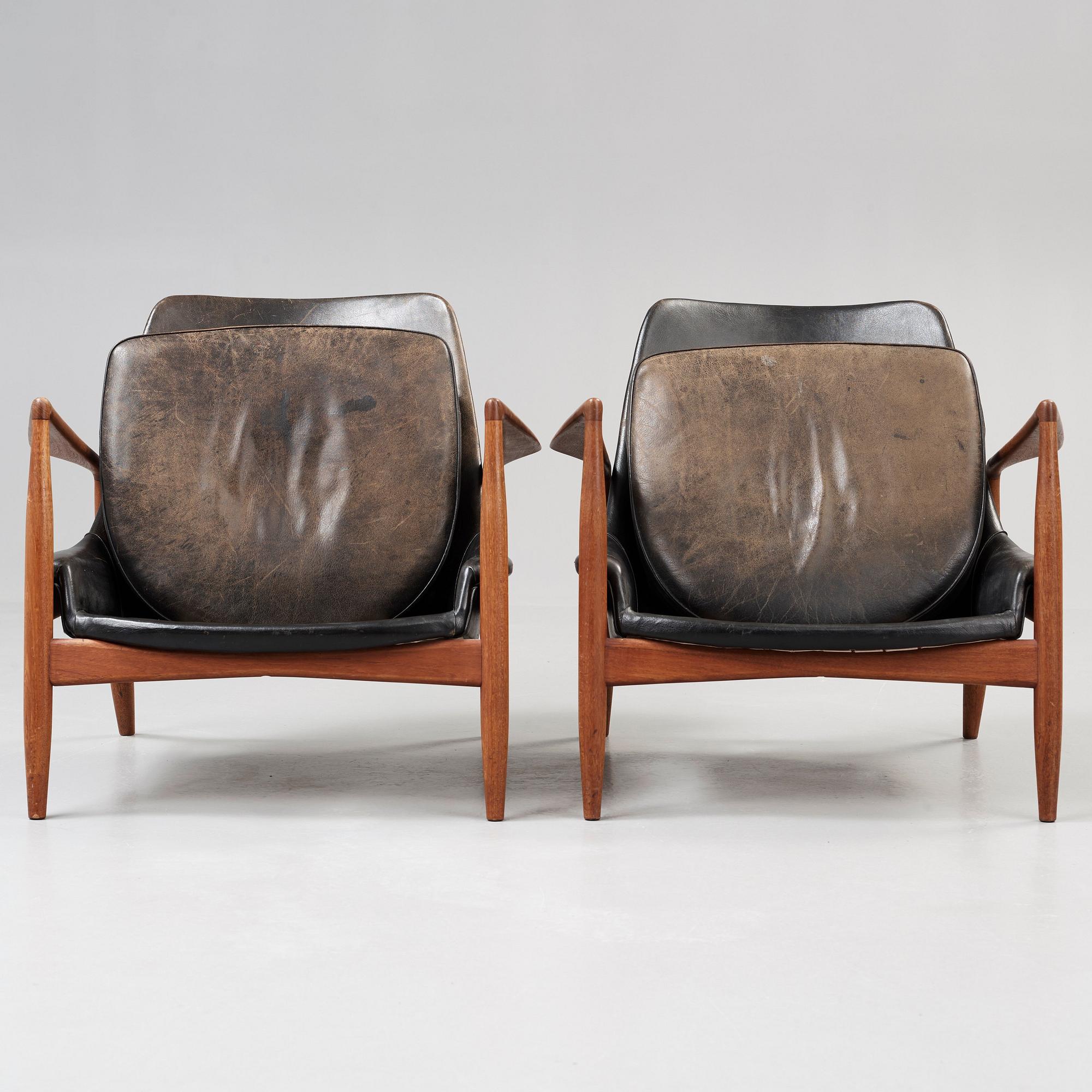 A pair of Olof Persson 'Seal' teak and black leather easy chairs, Olof Persson Möbler, Jönköping 1950's-60's.