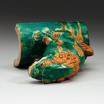 A sancai glazed roof tile figure of a mythological animal, Ming dynasty, 17th Century.