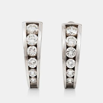 1203. A pair of brilliant-cut diamond earrings. Total carat weight of diamonds circa 1.30 cts.