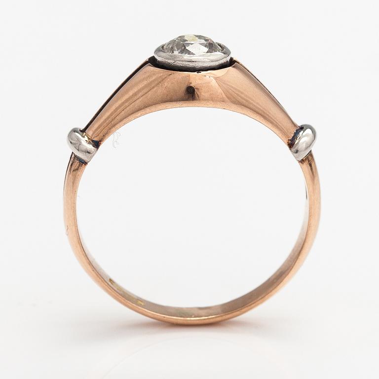 A 14K gold ring with a ca. 0.66 ct old-cut diamond.