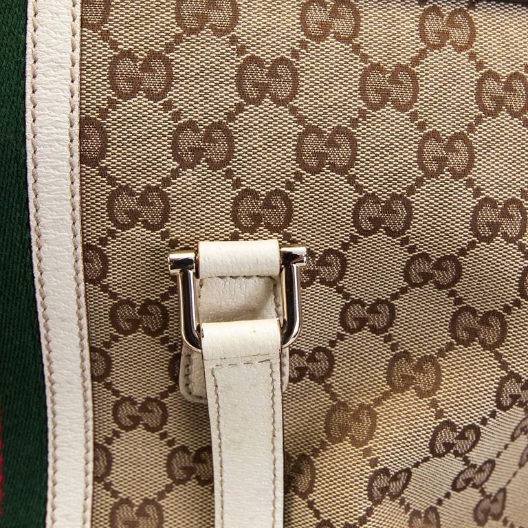 A Gucci canvas and leather hand bag.