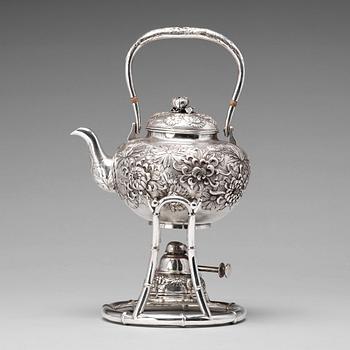 A Japanese silver tea pot with burner and stand, makers mark Samurai Shokai, Yokohama, Sterling.