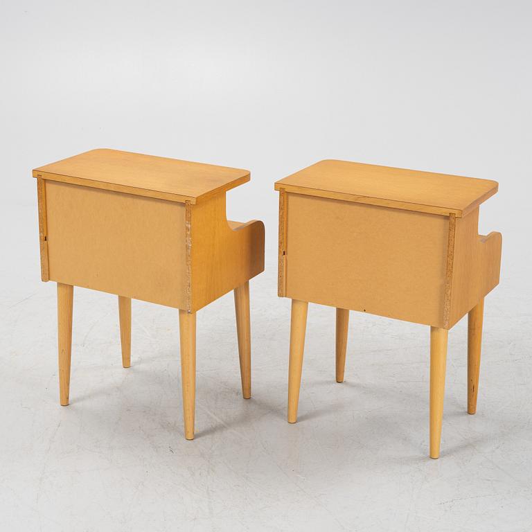 A pair of oak veneered bedside tables, mid 20th Century.
