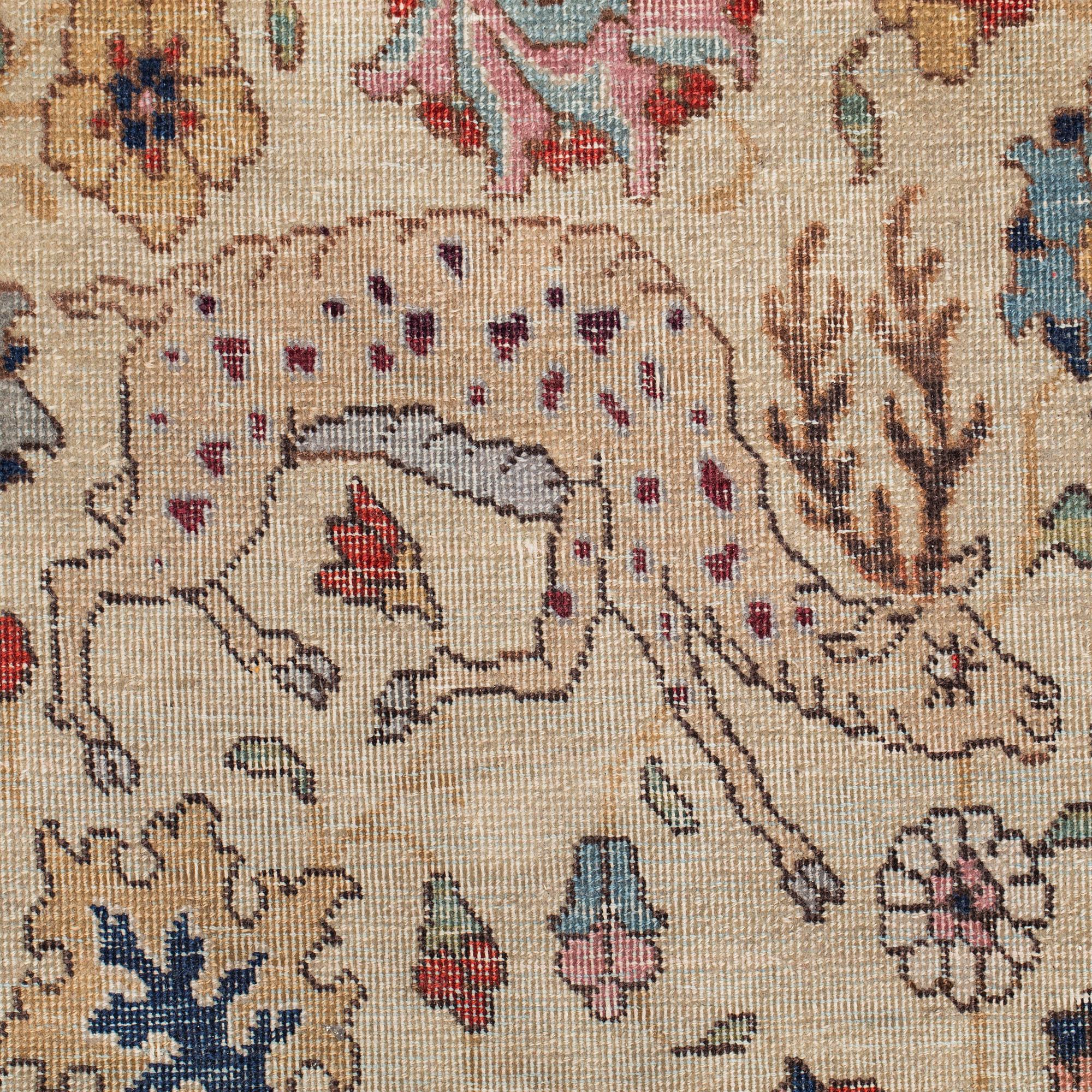 A CARPET, a semi-antique Tabriz, around 422 x 310 cm.